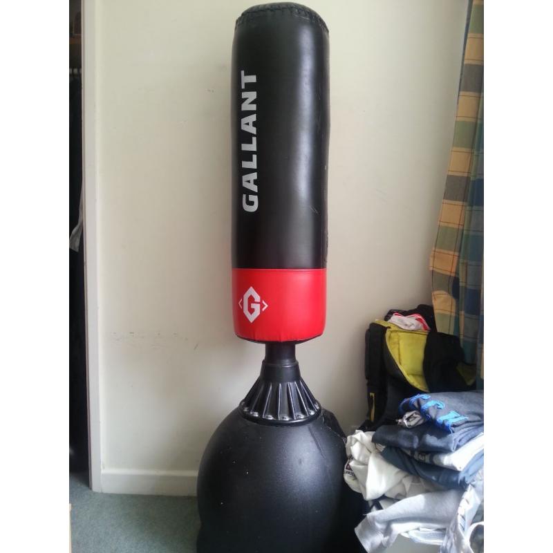 free standing punch bag, condition is good, two parts were torn.....................................
