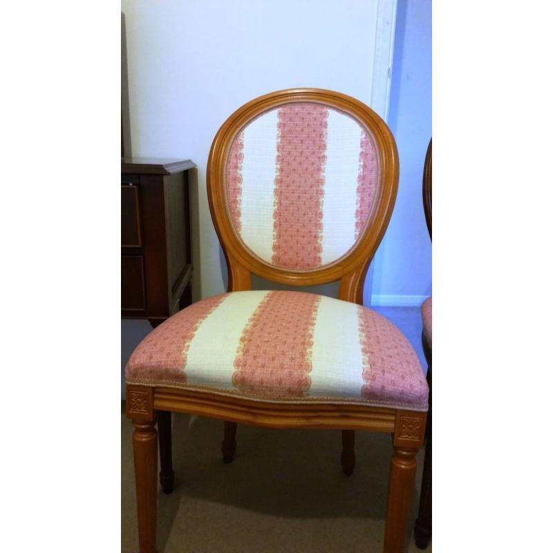 Two padded wooden chairs in excellent condition