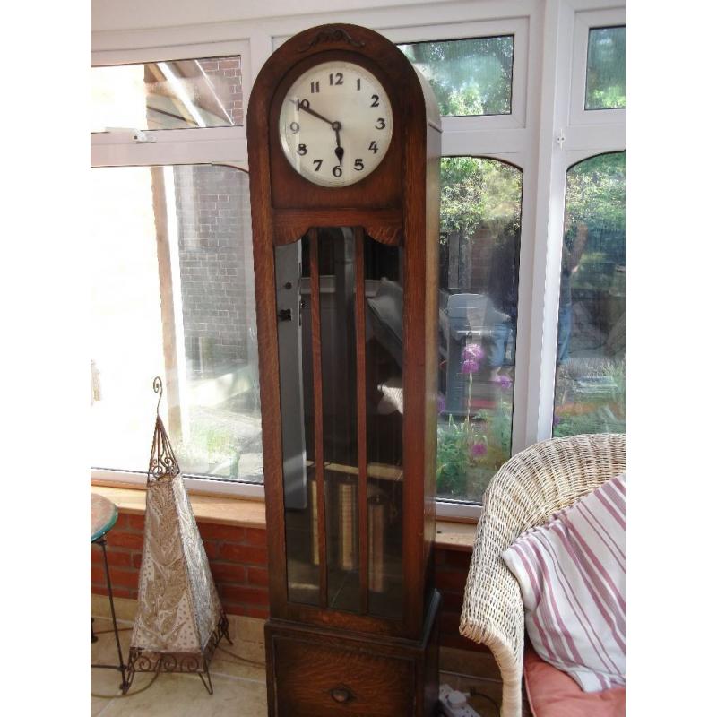 AN OAK ART DECO LONGCASE GRANDFATHER CLOCK