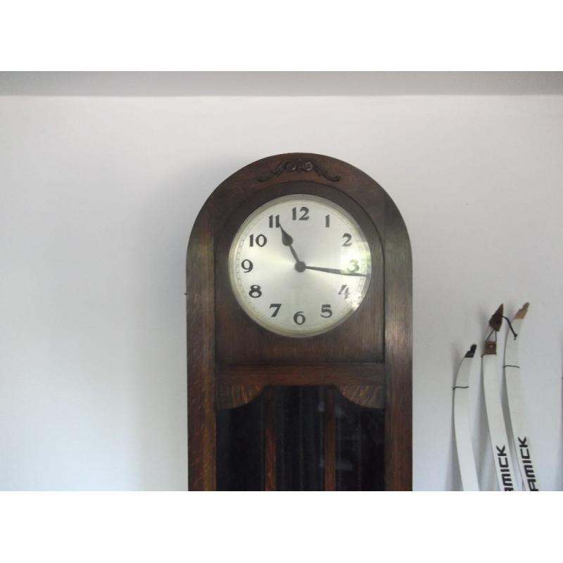 AN OAK ART DECO LONGCASE GRANDFATHER CLOCK