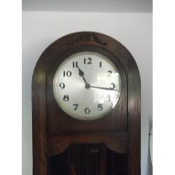 AN OAK ART DECO LONGCASE GRANDFATHER CLOCK