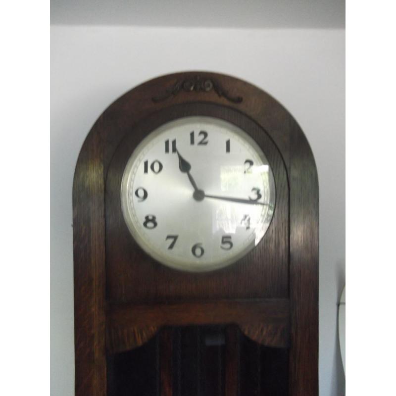 AN OAK ART DECO LONGCASE GRANDFATHER CLOCK