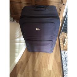 Black hold luggage suitcase with handles and wheels