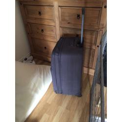 Black hold luggage suitcase with handles and wheels