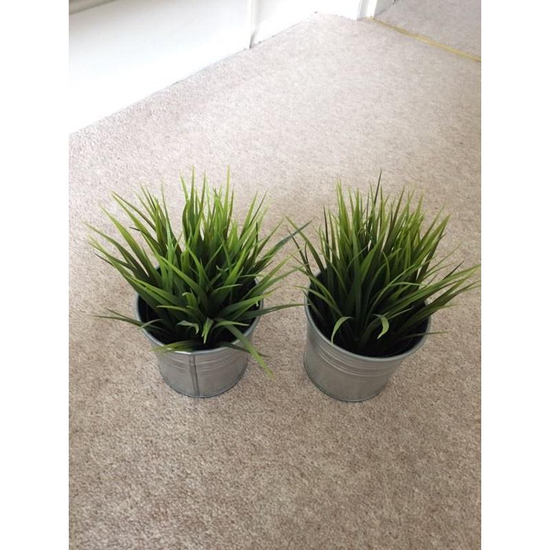 2 fake potted plants