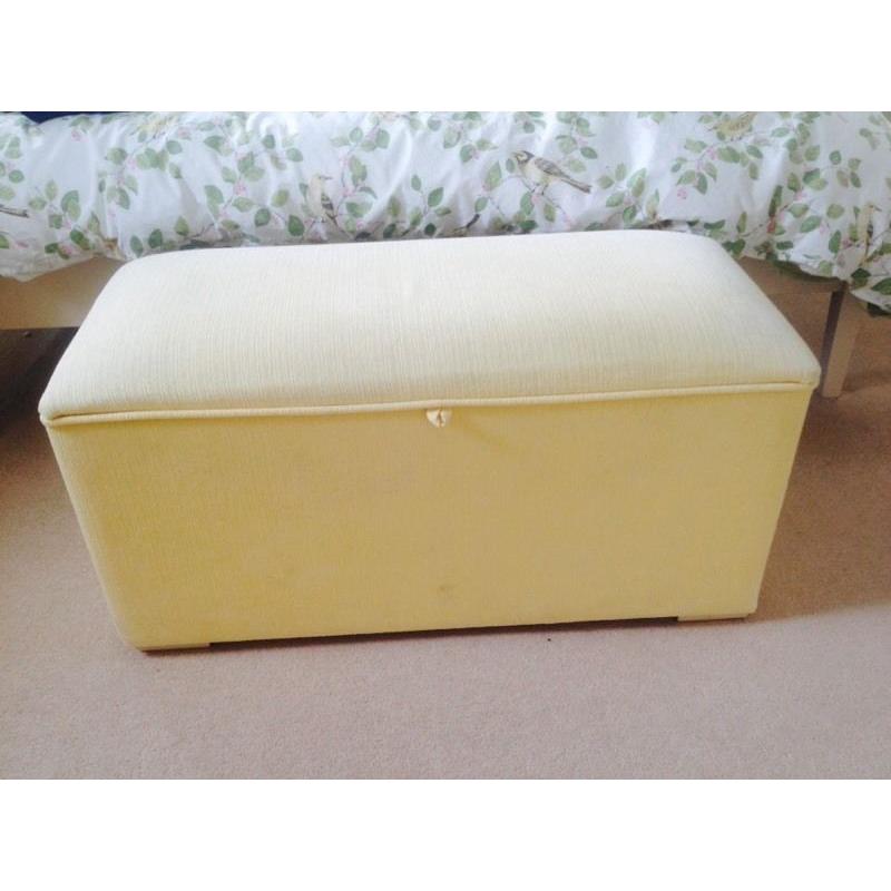 Pale yellow ottoman