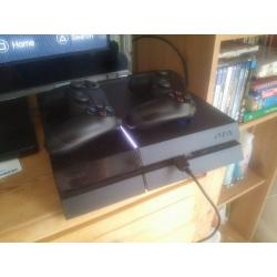 Playstation 4 with 2 controllers and 7 games