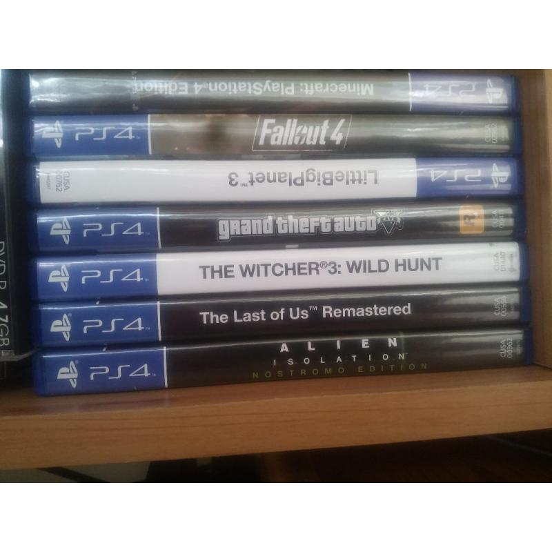 Playstation 4 with 2 controllers and 7 games