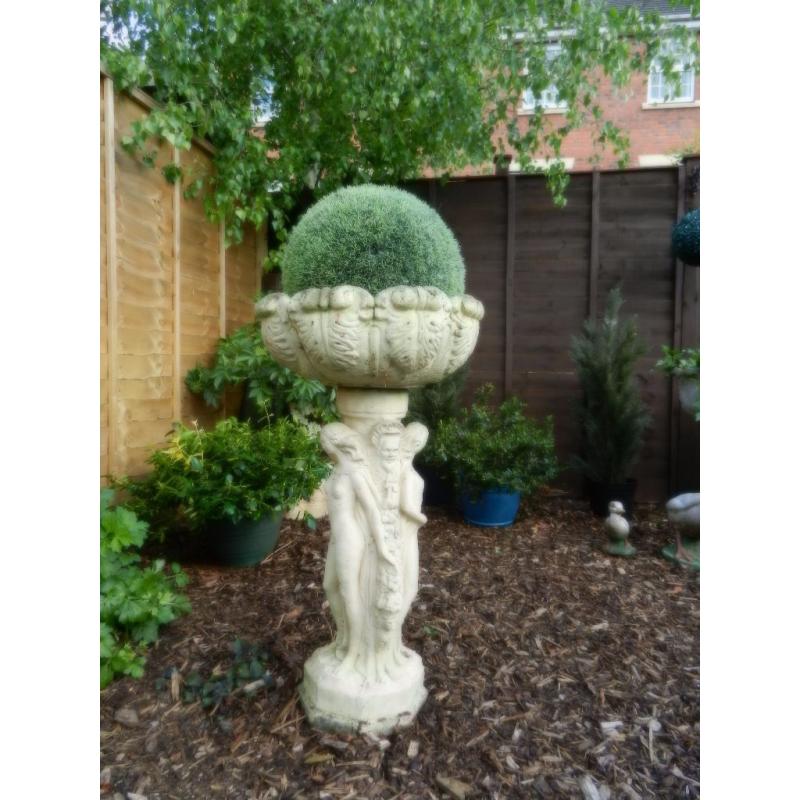 Old stone figurine planter