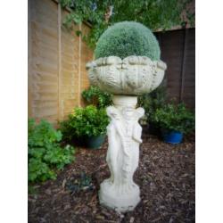 Old stone figurine planter