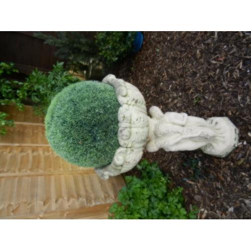 Old stone figurine planter