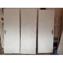 3 Fire Doors with handles 27in x 76in. One at 27x73 and half in