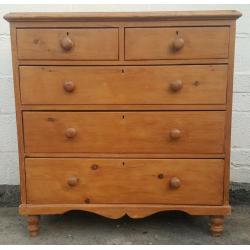 An antique pine chest of drawers