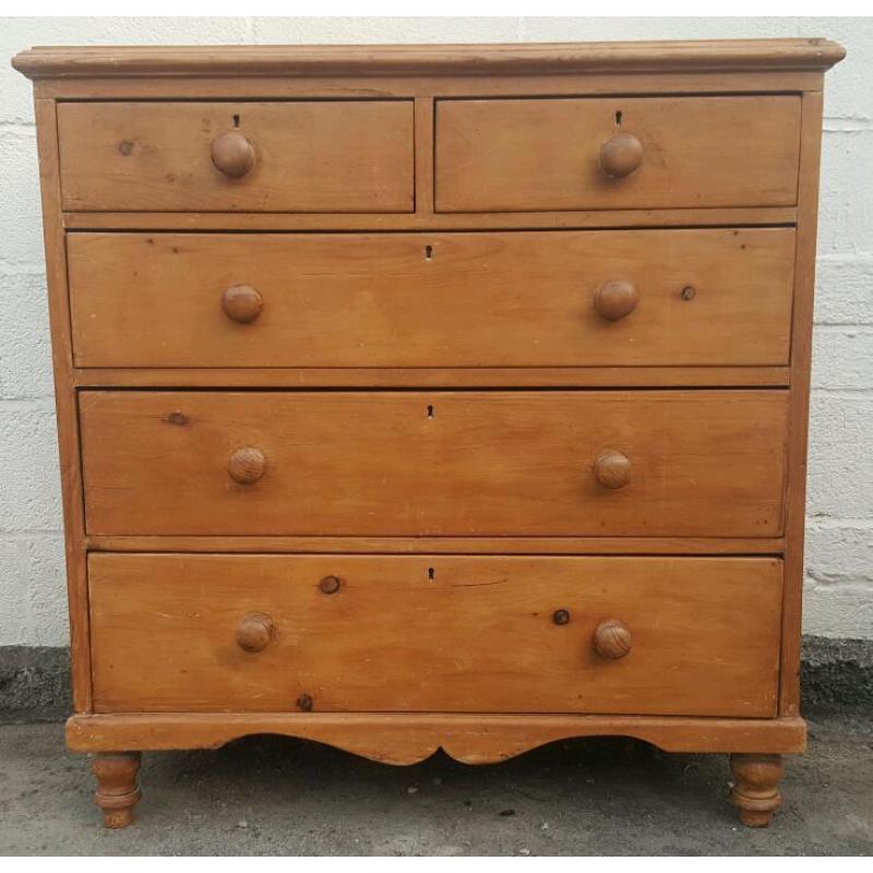 An antique pine chest of drawers
