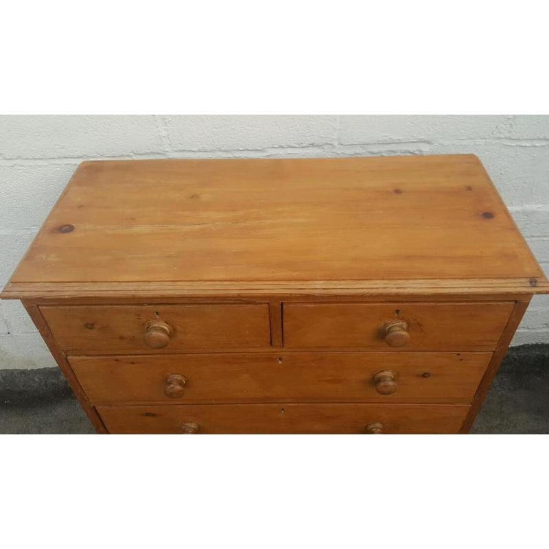An antique pine chest of drawers