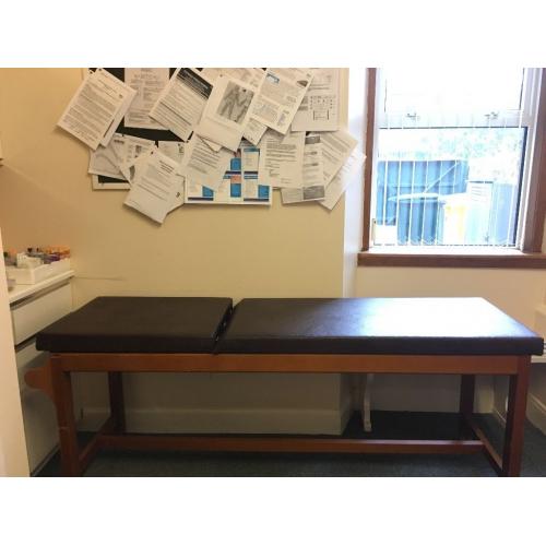 Brown Examination couch. Examination couch suitable for massage or other therapeutic use