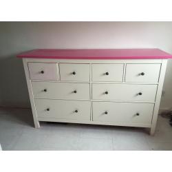 white chest of drawers with pink top