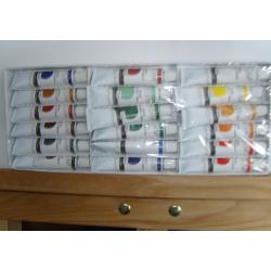 easel,brushes,paints & 2 canvasses-new in box-unwanted gift