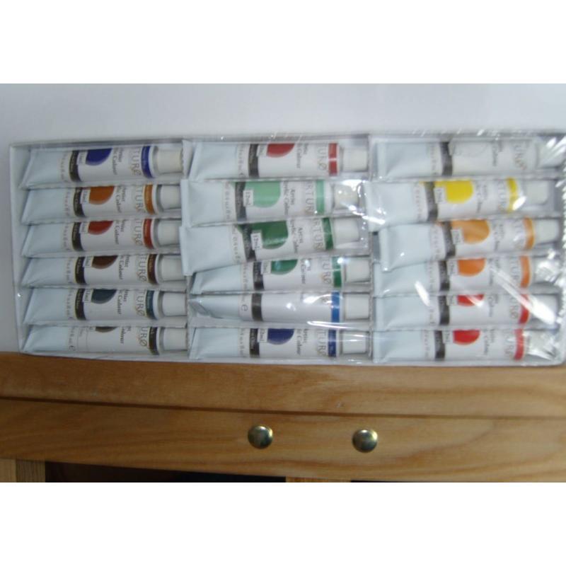 easel,brushes,paints & 2 canvasses-new in box-unwanted gift