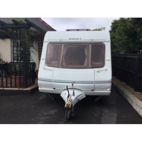 September 2004 Swift Conqueror 645 lux 4 berth twin axle caravan including full size awing