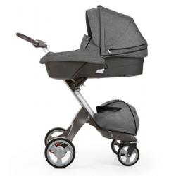 Stokke carry cot in black melange with raincover