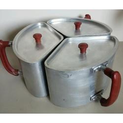Vintage space saving saucepans with bakelite handles