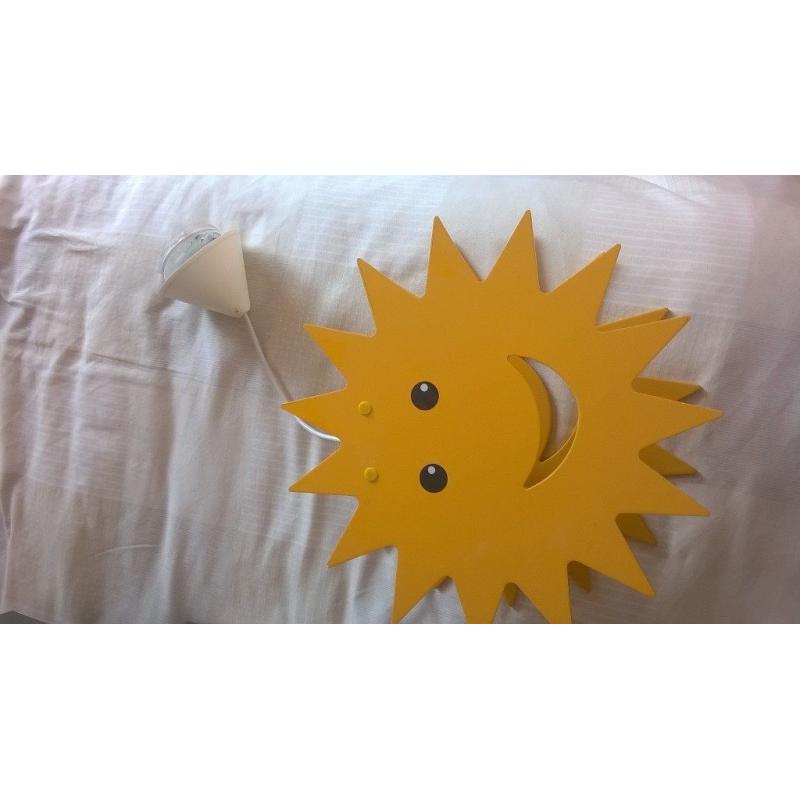 A yellow sun ceiling light