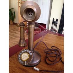 Old brass candle stick phone