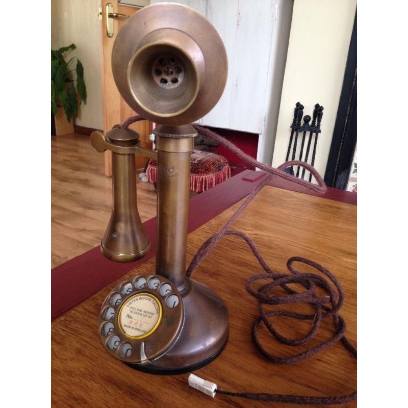 Old brass candle stick phone
