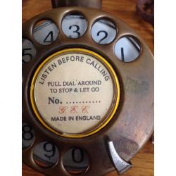 Old brass candle stick phone