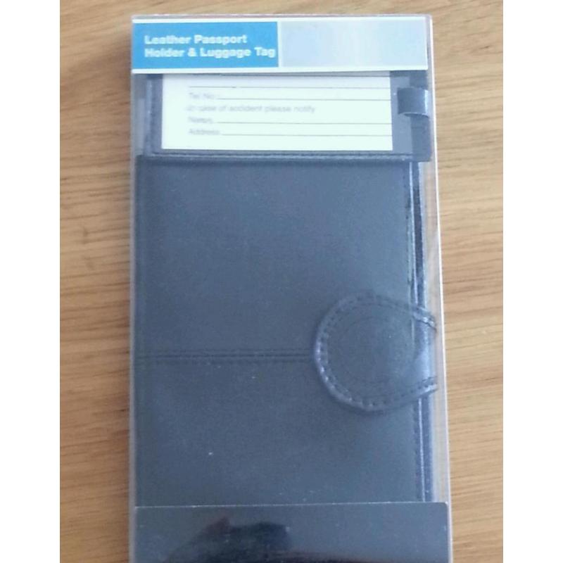 PASSPORT HOLDS AND TAG