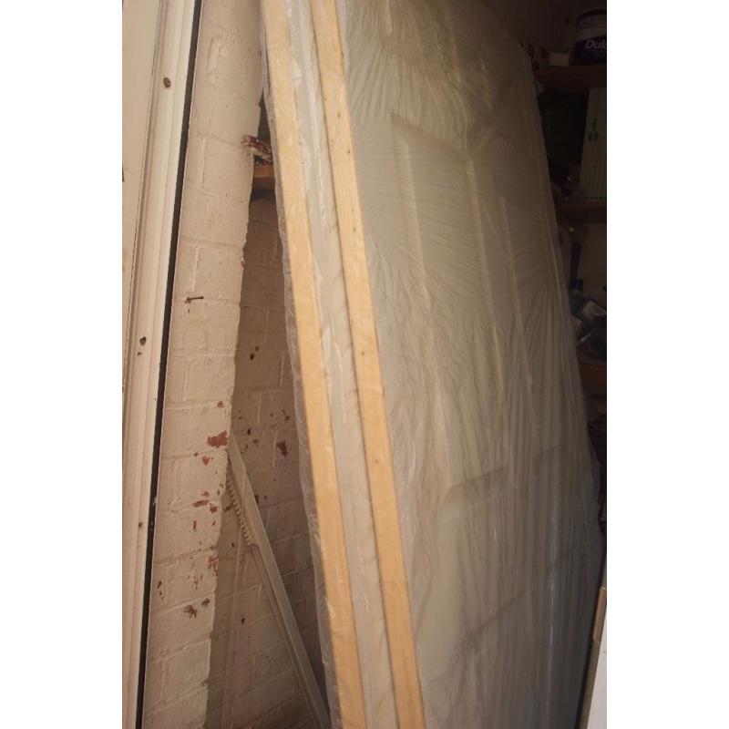 (DOORS)2 New Interior doors still in plastic rapping for sale 92.5 cm wide 205cm long.