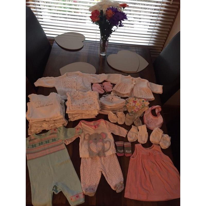 Bundle of newborn baby clothes