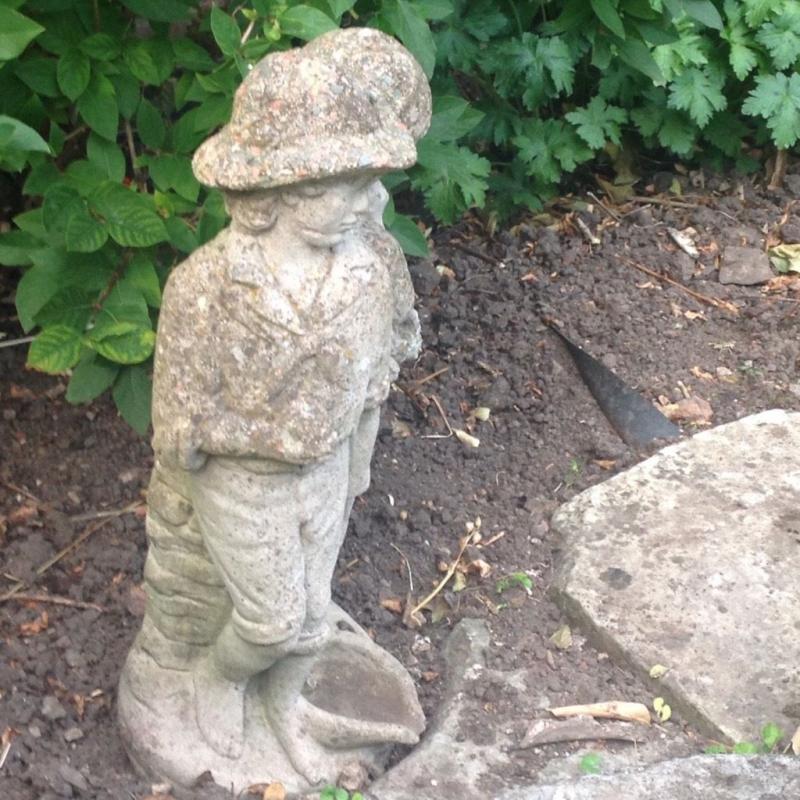 Boy and girl stone statue