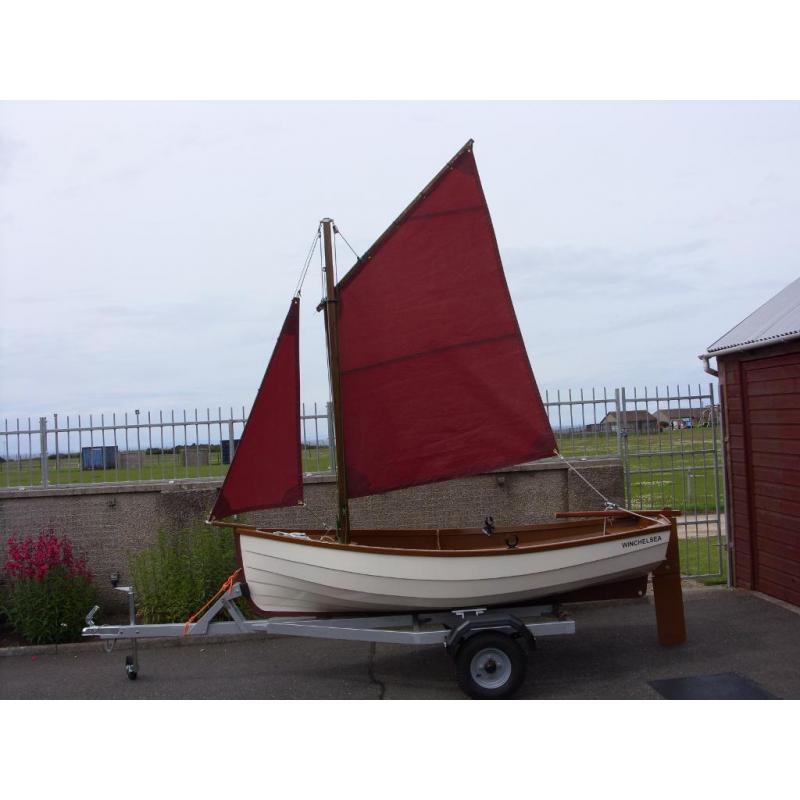 Sailing and rowing dinghy with trailer