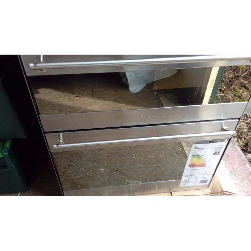 New and unused Smeg under counter multi function double oven