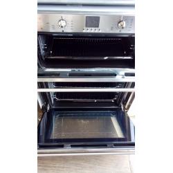 New and unused Smeg under counter multi function double oven