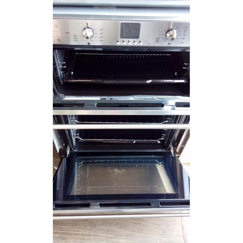 New and unused Smeg under counter multi function double oven
