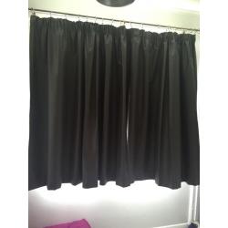 Silver blackout curtains, curtain rings and chrome curtain pole.
