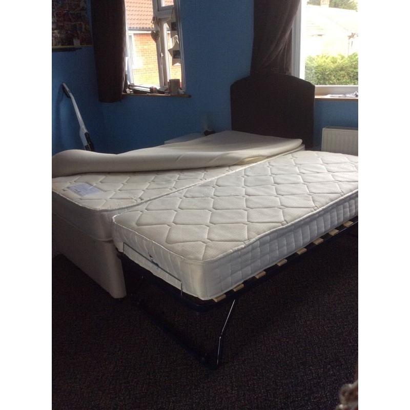 Single bed with guest bed underneath