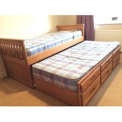 Single bed with pull out single bed, 2 mattresses and 3 drawers