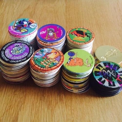 Assorted pogs, tazos slammer whammers