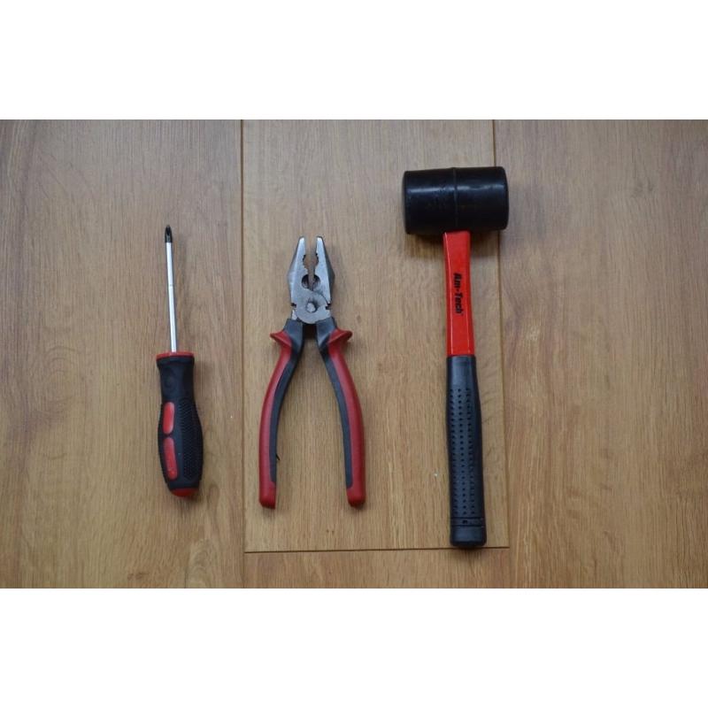 Cross-head screwdriver, pliers and rubber mallet