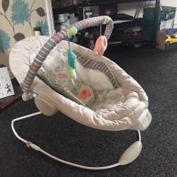Baby bouncer in great condition. Vibrating and music settings to soothe baby. Neutral colours.