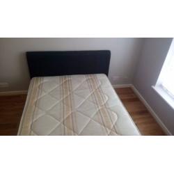 Blue doublebed with mattress
