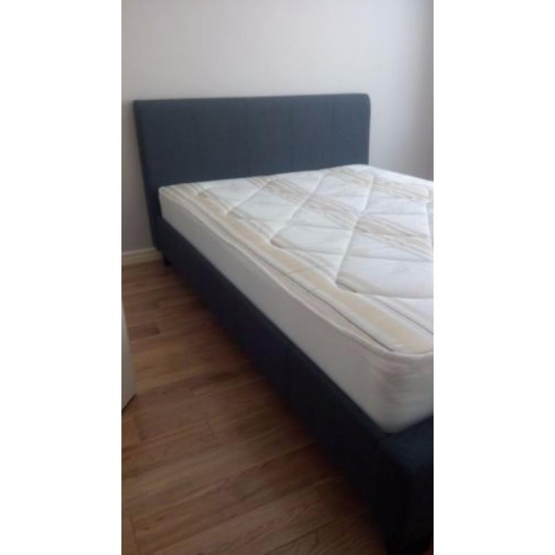 Blue doublebed with mattress