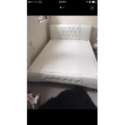 White bed frame with matress