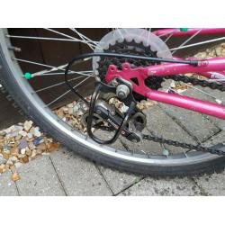 Girls 12.5" mountain bike with full suspension and grip shift gears