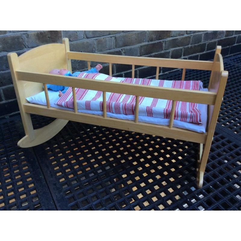 Wooden toy rocking crib