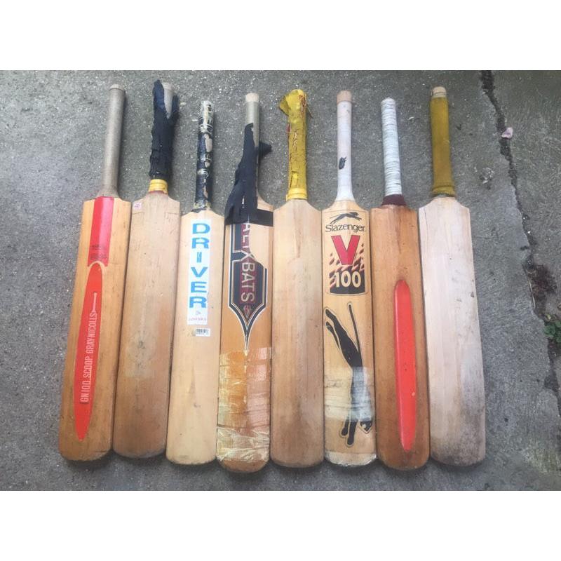 Collection of 8 well used Cricket bats for sale, and two pairs of cricket gloves